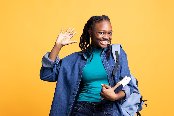 Home imgi 2 close up shot upbeat student holding textbooks greeting colleagues 482257 116048
